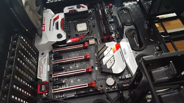 A gaming PC motherboard undergoing technical diagnostics and quality testing
